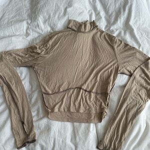 Cropped turtle neck long sleeve top w/underbust detail